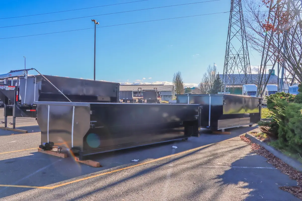 Roll-off dumpster ready for waste disposal at job site for Concrete Dumpster Rental in Redan